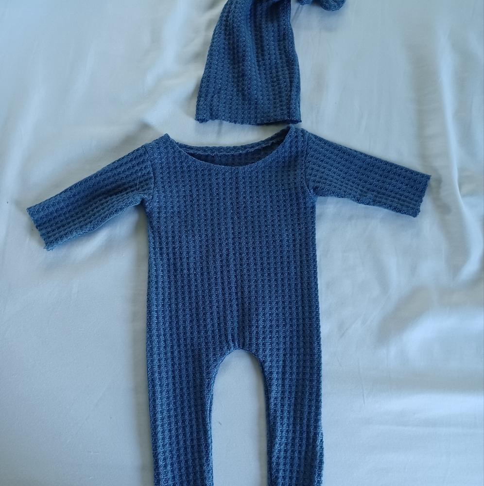Blue onesie for photos with hat.